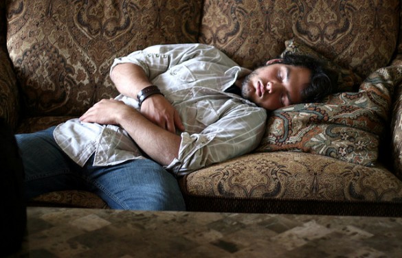 man-sleeps-on-couch