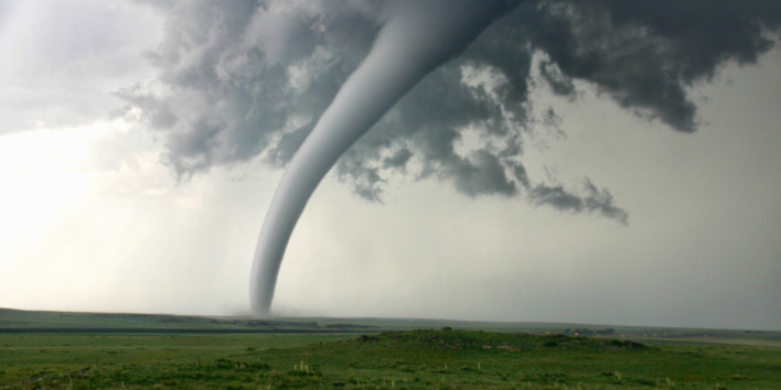 Tornado column in rural landscape